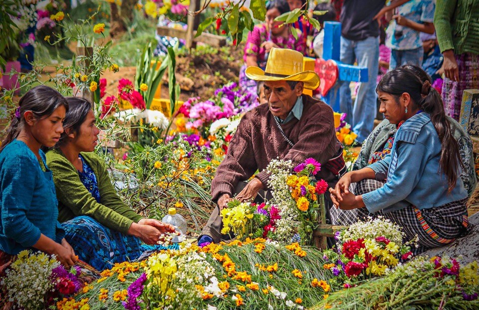 Locals selling flowers at the Solola market