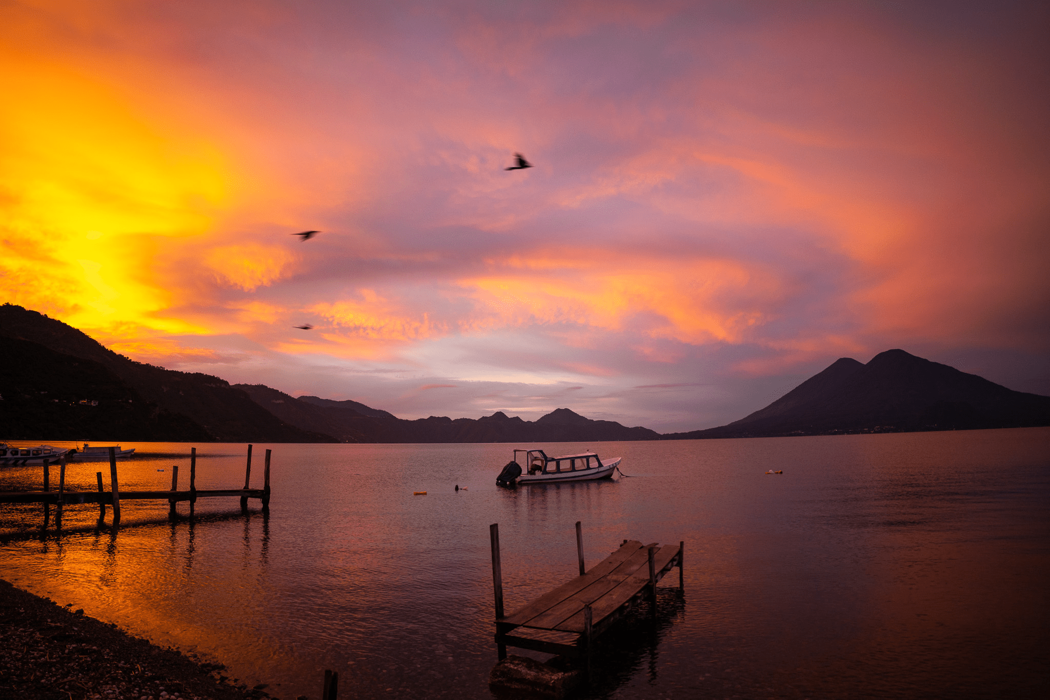 Beautiful sunset with red yelow and blue colours over the lake.