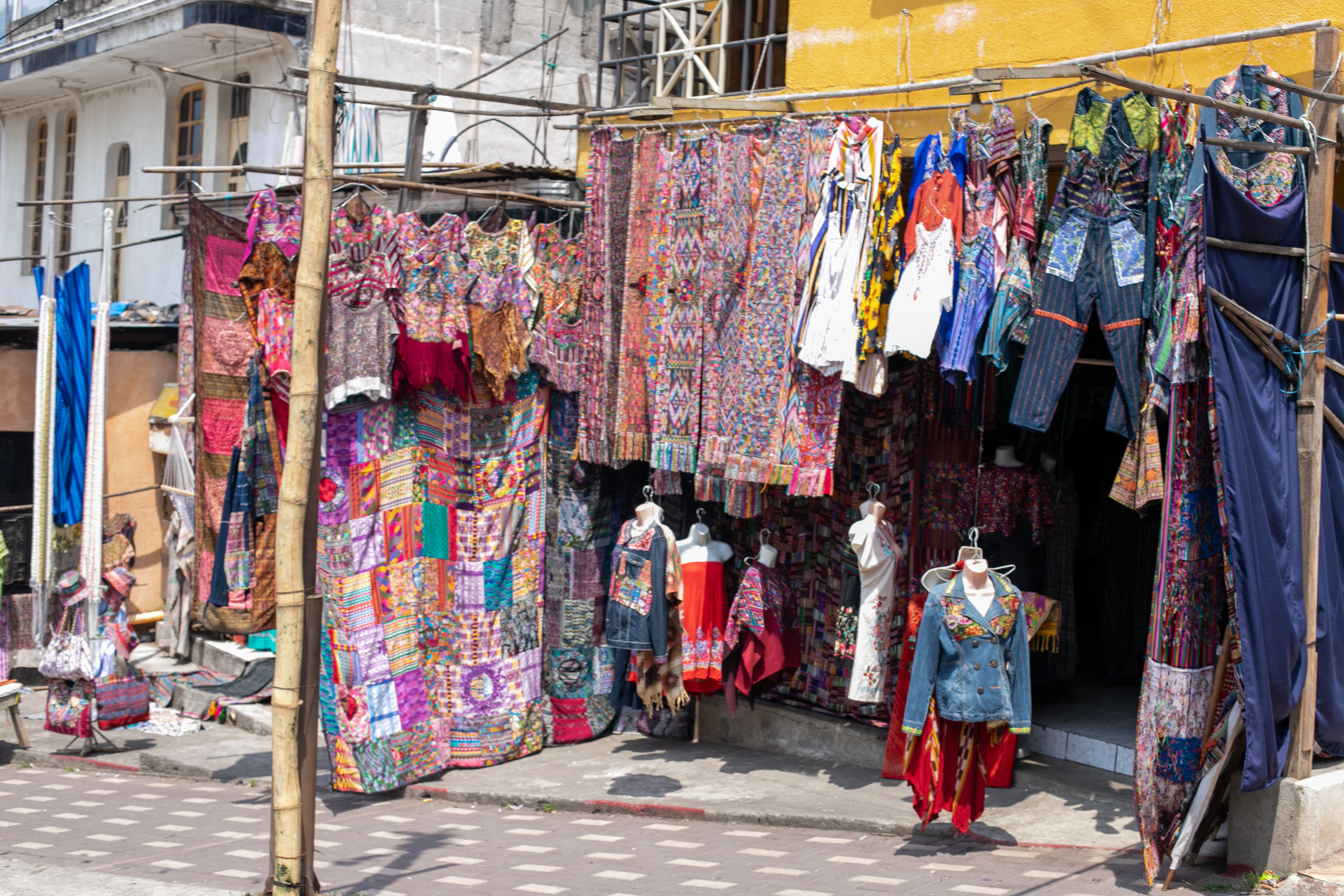 Street vendor selling traditional clothes and weaving.