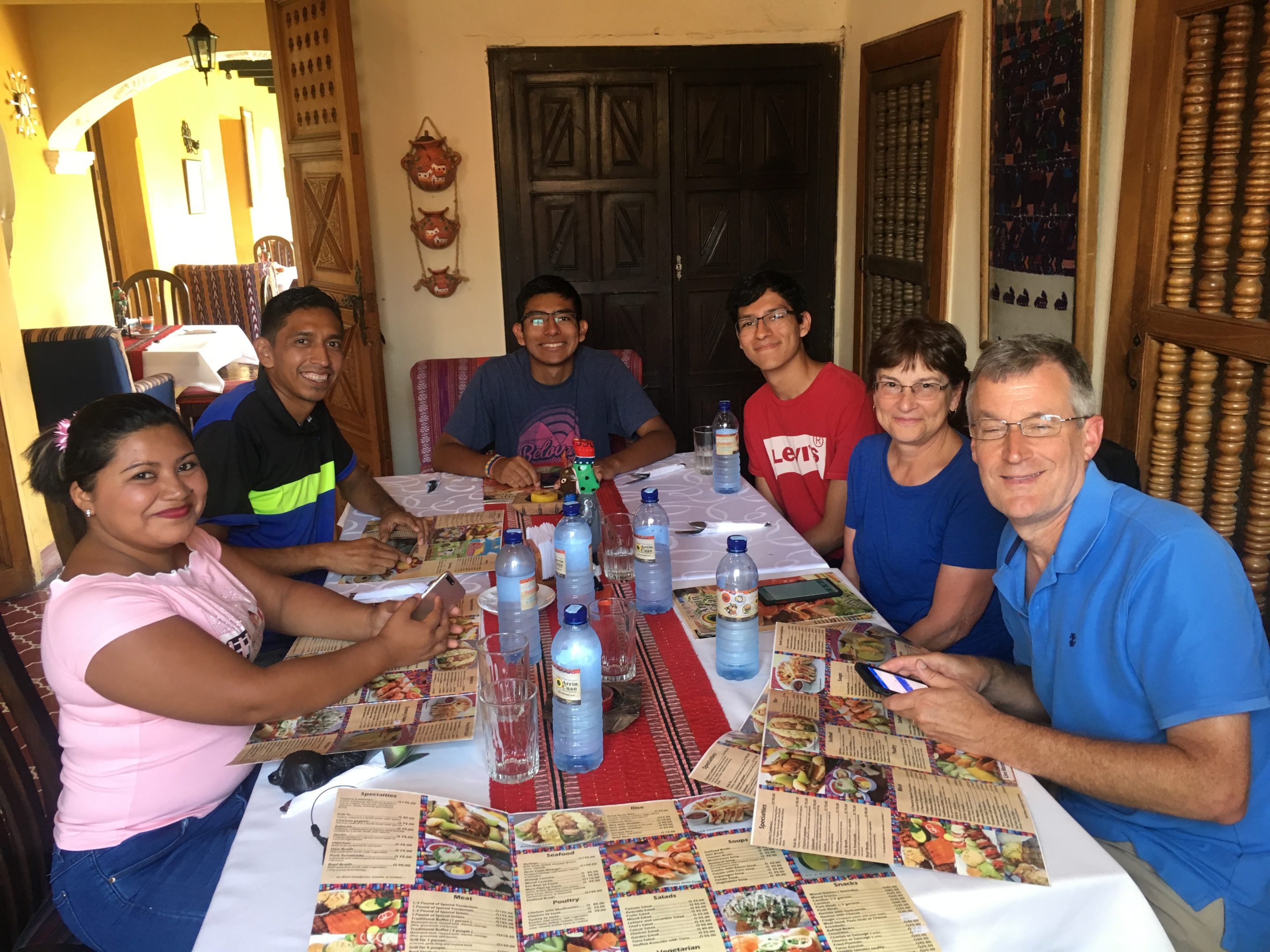 A family enjoying a cooking class.  It can be a great activity during rainy season. 